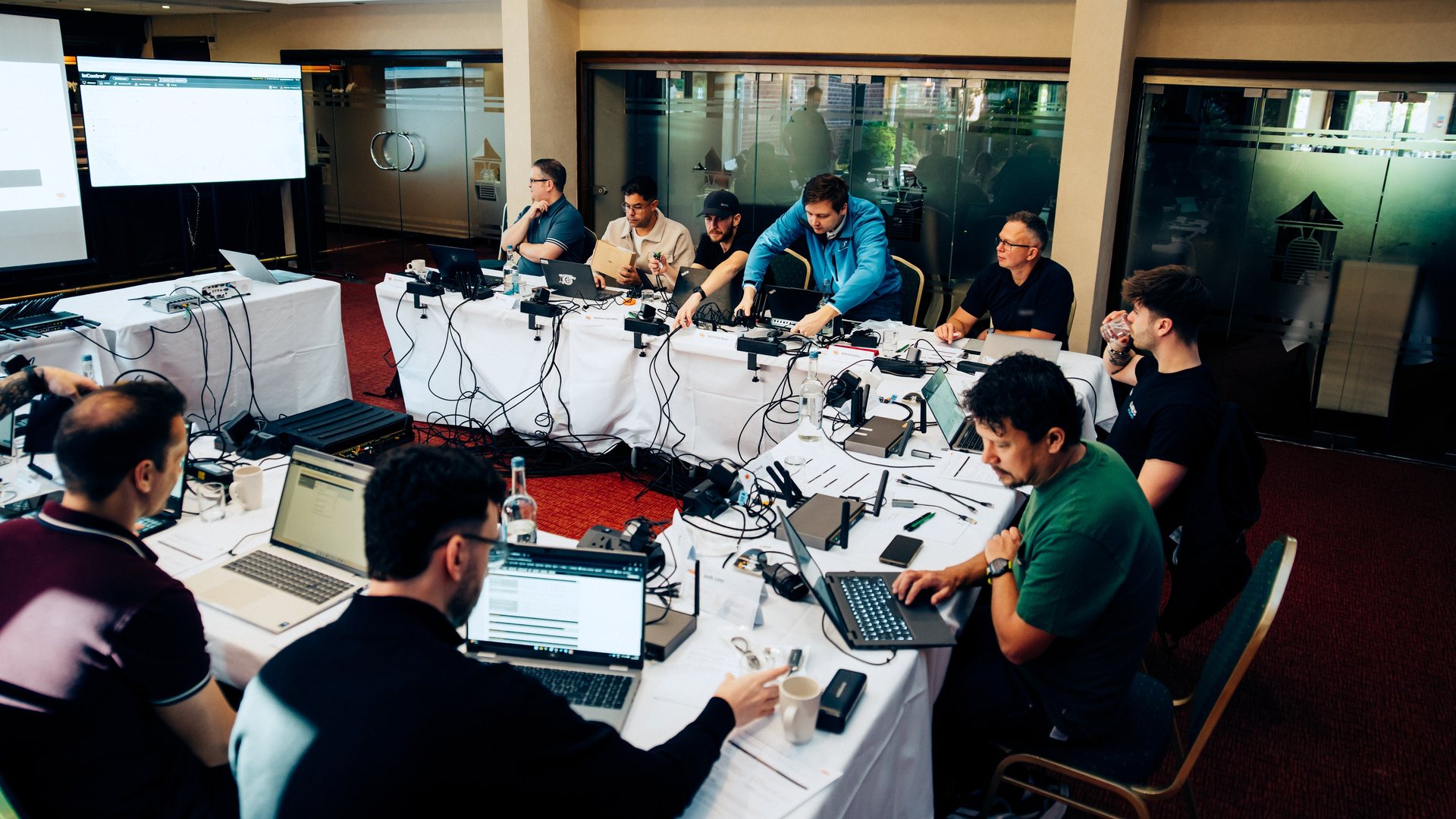 Delegates working on Peplink hardware at the UK Masterclass, October 2026