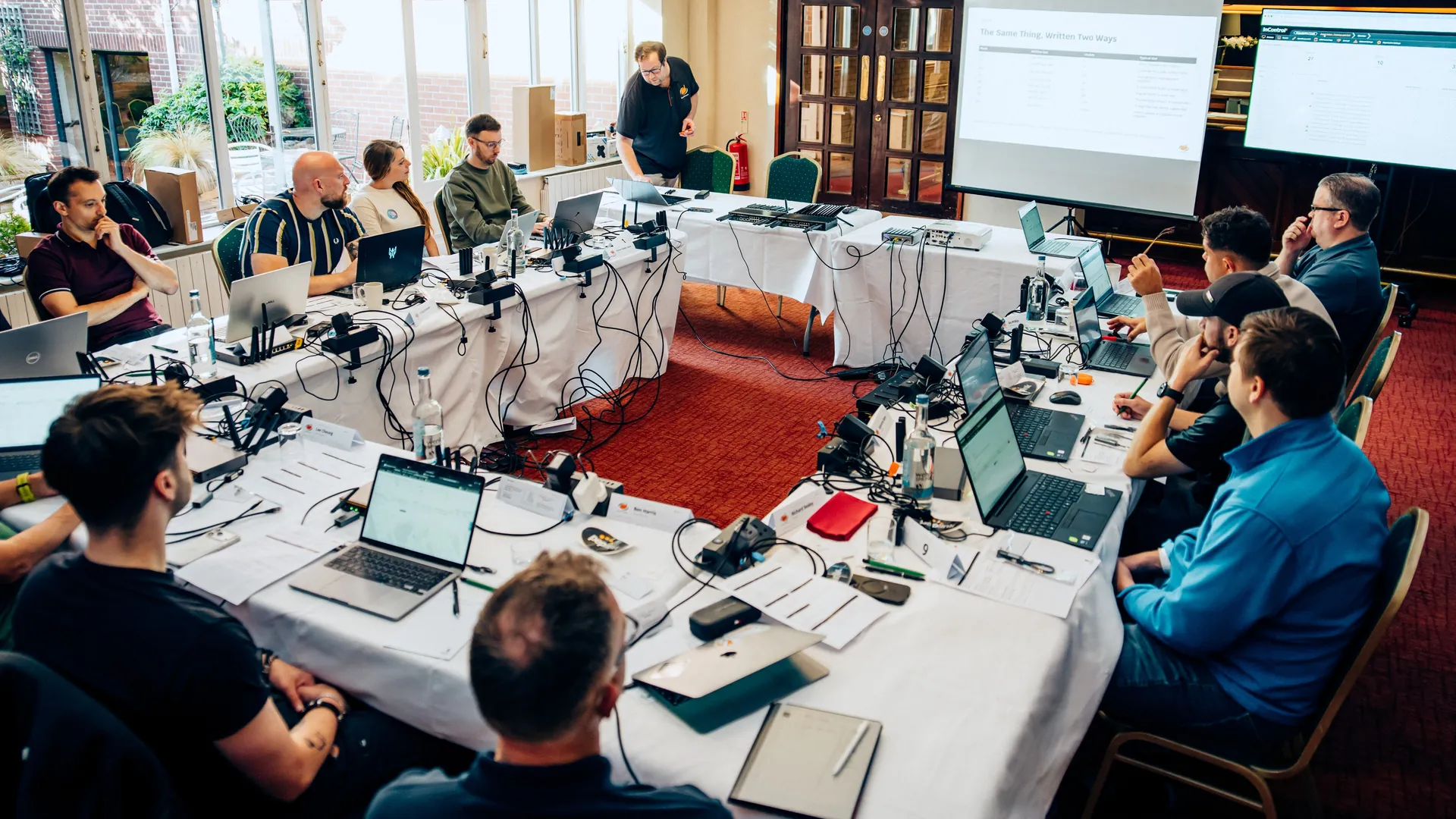 Delegates working on Peplink hardware at their benches during the UK Masterclass
