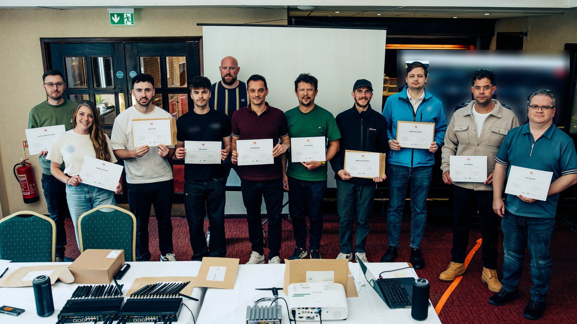 The first UK Masterclass cohort holding their certificates of attendance